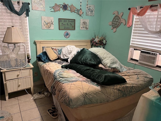 bedroom with cooling unit and light tile patterned flooring