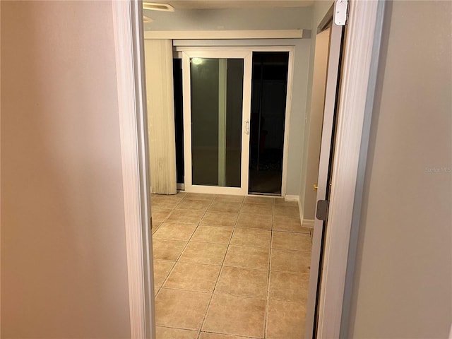 hallway featuring light tile patterned flooring