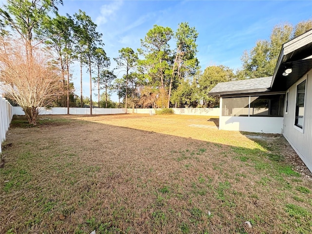 view of yard featuring a sunroom