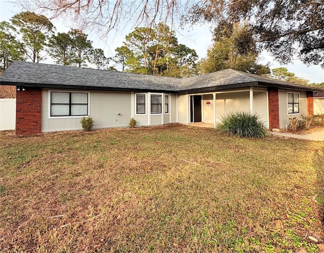 single story home with a front yard