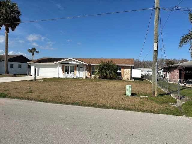 ranch-style home with a front lawn and a garage