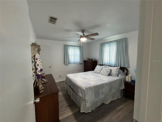 bedroom featuring dark wood-type flooring and ceiling fan