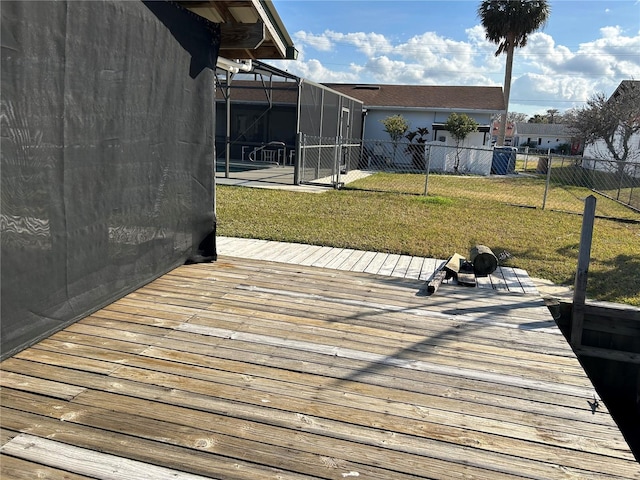 deck with a yard and glass enclosure