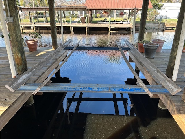 view of dock with a water view