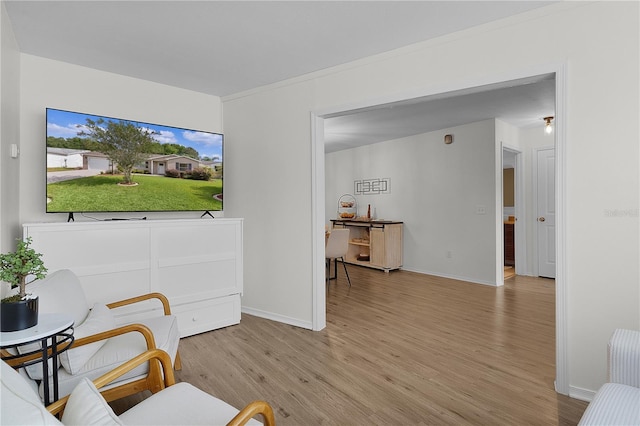 living room featuring light wood-style flooring and baseboards