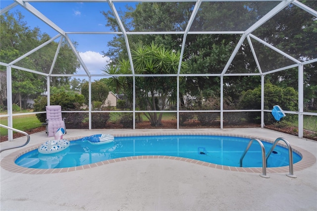 outdoor pool featuring a lanai and a patio