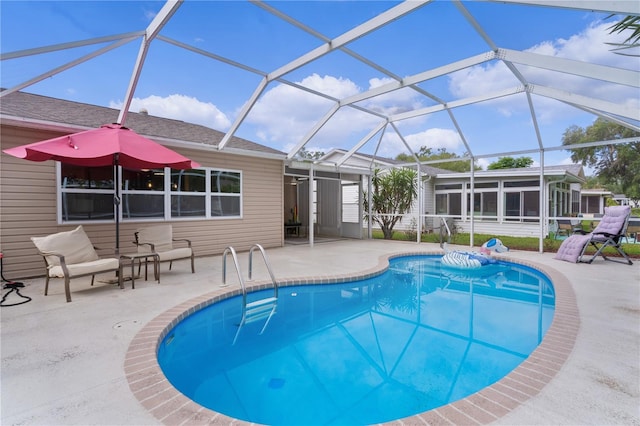swimming pool with a patio and a sunroom