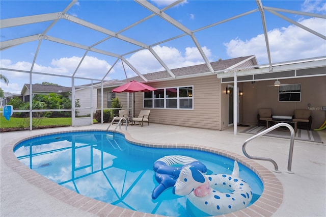 swimming pool featuring a patio area, ceiling fan, and glass enclosure