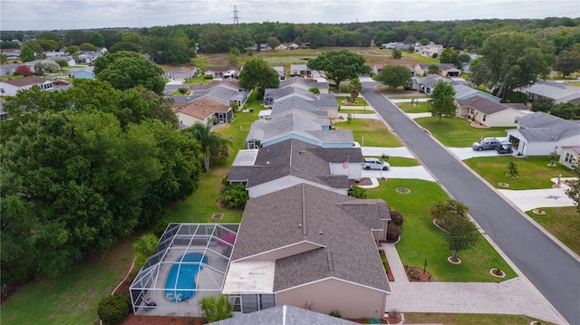 aerial perspective of suburban area featuring a pool area