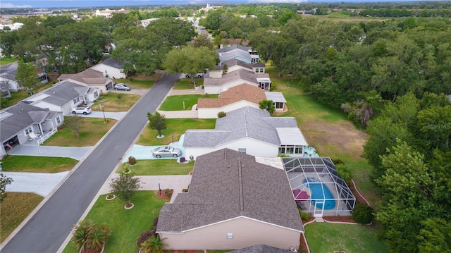 aerial perspective of suburban area featuring a pool
