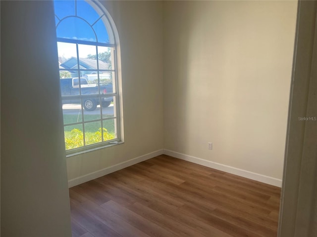 spare room featuring hardwood / wood-style floors