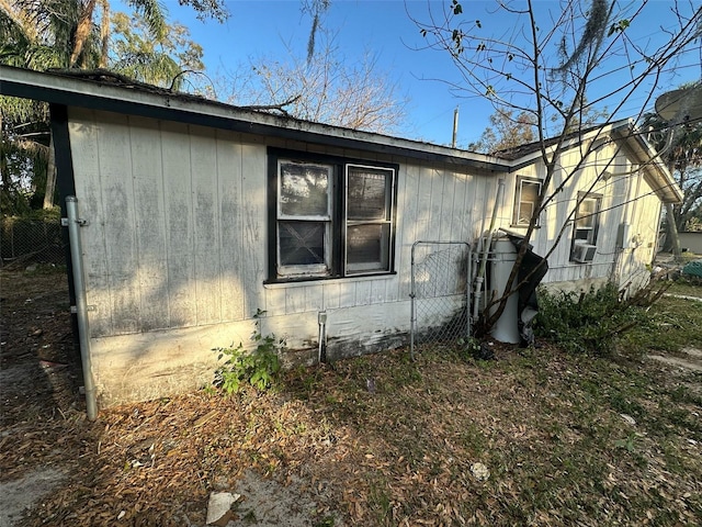 view of side of home with cooling unit