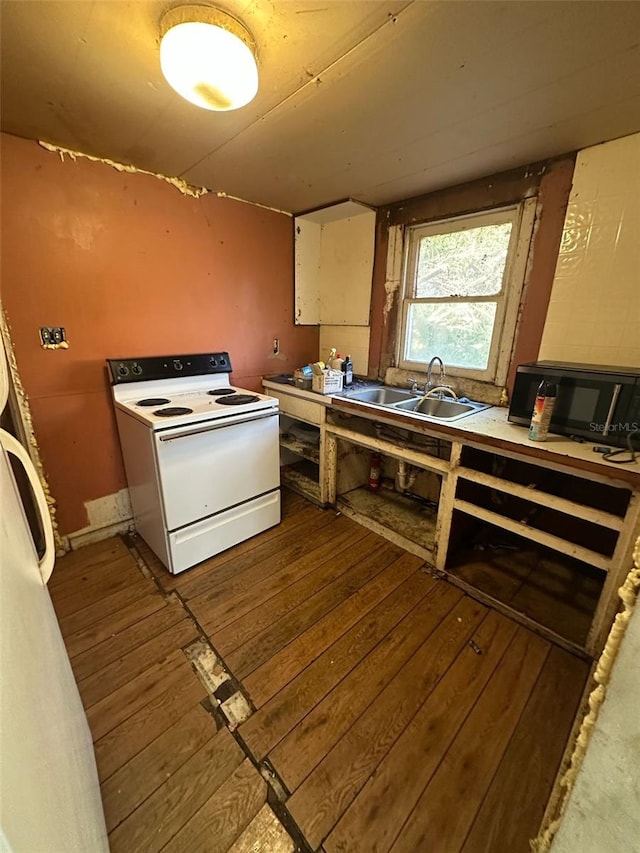 kitchen with hardwood / wood-style flooring, sink, and white range with electric stovetop