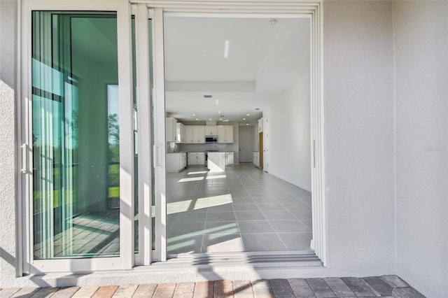 property entrance featuring an outdoor kitchen