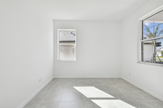 unfurnished room with light tile patterned floors