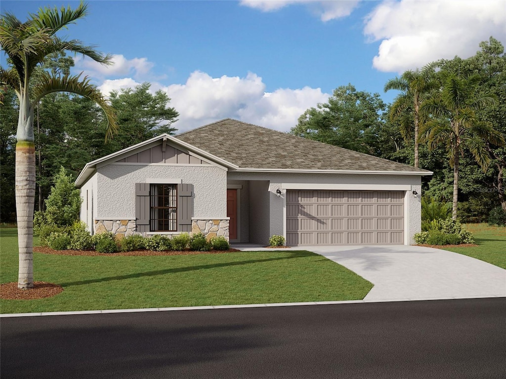 view of front of home with a garage and a front yard