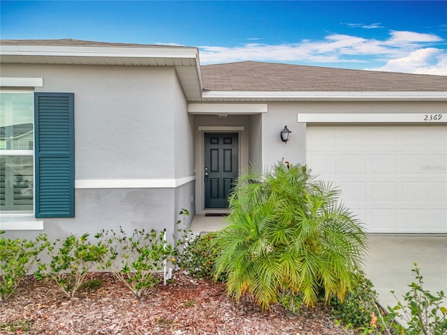 doorway to property featuring a garage