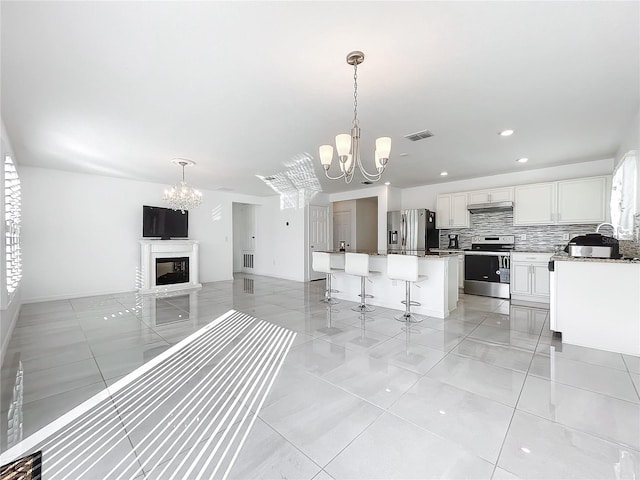 unfurnished living room with a chandelier