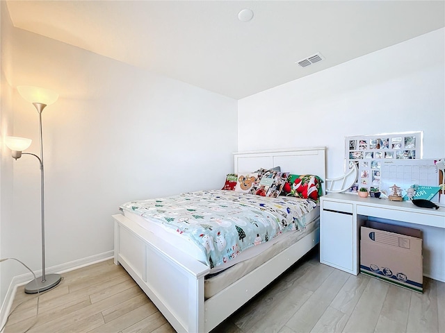 bedroom with light hardwood / wood-style floors