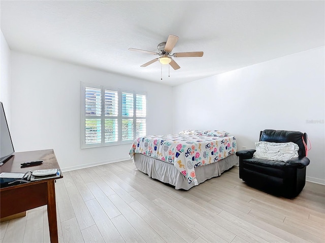 bedroom with ceiling fan and light wood-type flooring