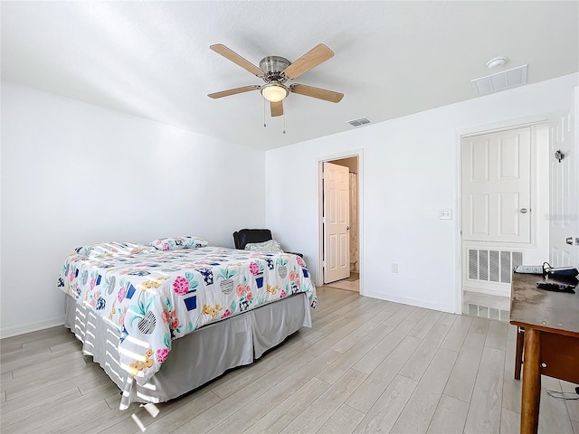 bedroom featuring light hardwood / wood-style floors and ceiling fan