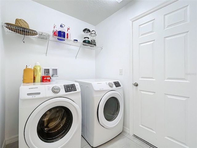 washroom featuring washer and dryer