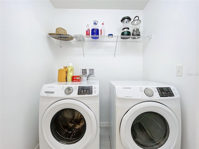 laundry area with washing machine and dryer