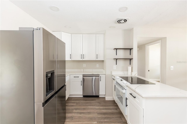 kitchen with a peninsula, visible vents, electric stove, stainless steel refrigerator with ice dispenser, and open shelves