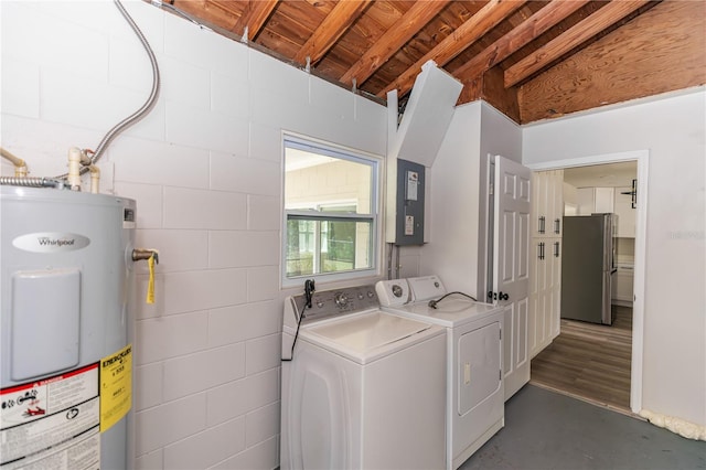laundry room featuring water heater, laundry area, independent washer and dryer, and concrete block wall
