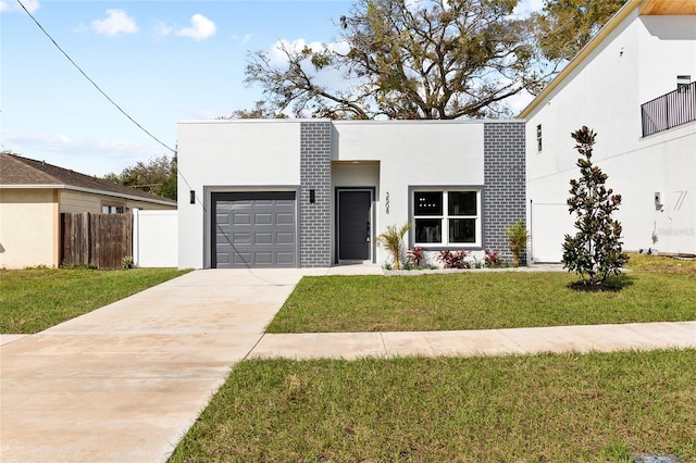 contemporary house with a garage and a front lawn