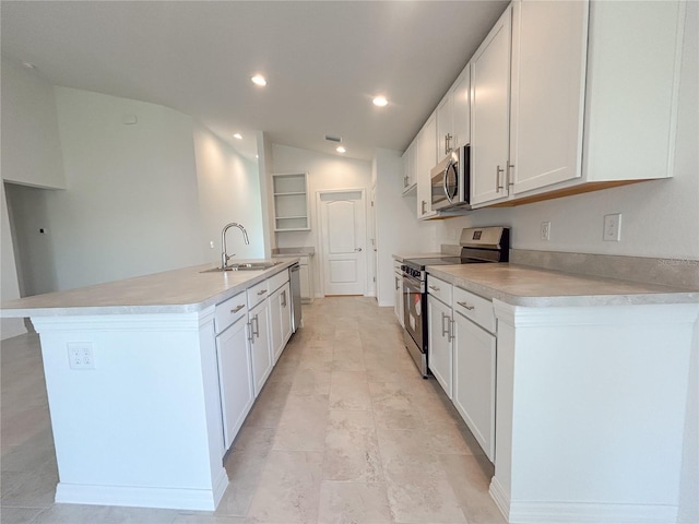 1212 Caloosa Ridge Ave, Babson Park, FL 33827 - kitchen featuring appliances with stainless steel finishes, a sink, white cabinets, light countertops, and vaulted ceiling