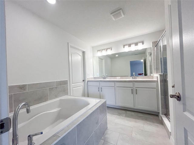 1212 Caloosa Ridge Ave, Babson Park, FL 33827 - bathroom featuring a bath, double vanity, and a shower stall