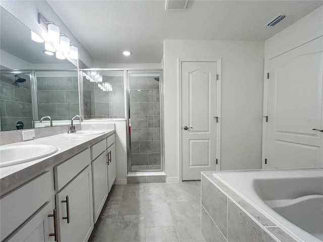 1212 Caloosa Ridge Ave, Babson Park, FL 33827 - full bath with a stall shower, double vanity, a relaxing tiled tub, and recessed lighting