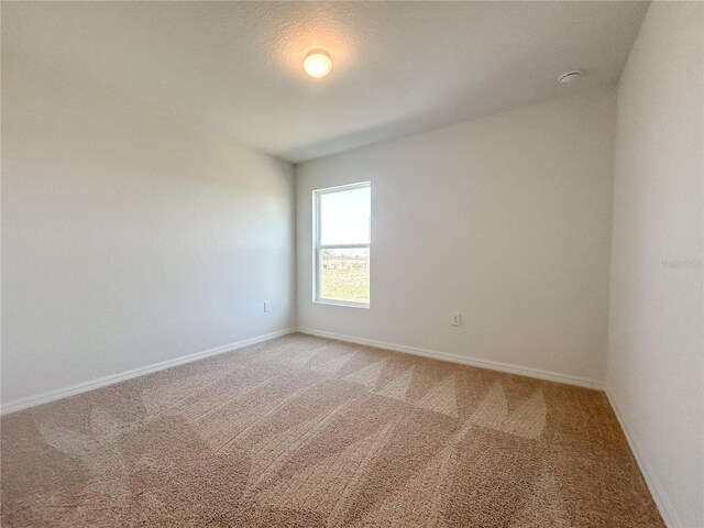 1212 Caloosa Ridge Ave, Babson Park, FL 33827 - empty room with light colored carpet and baseboards