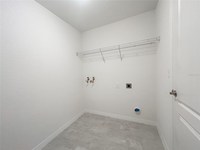 1212 Caloosa Ridge Ave, Babson Park, FL 33827 - washroom with hookup for an electric dryer, baseboards, washer hookup, and light marble finish floors