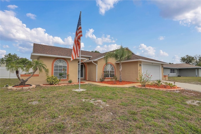 ranch-style house with an attached garage, stucco siding, and a front yard