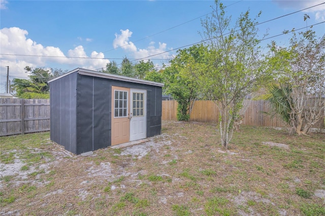 view of shed featuring a fenced backyard