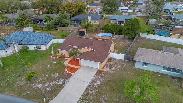 birds eye view of property with a residential view