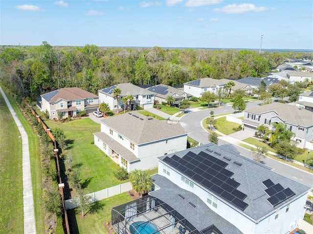 aerial view featuring a residential view and a view of trees