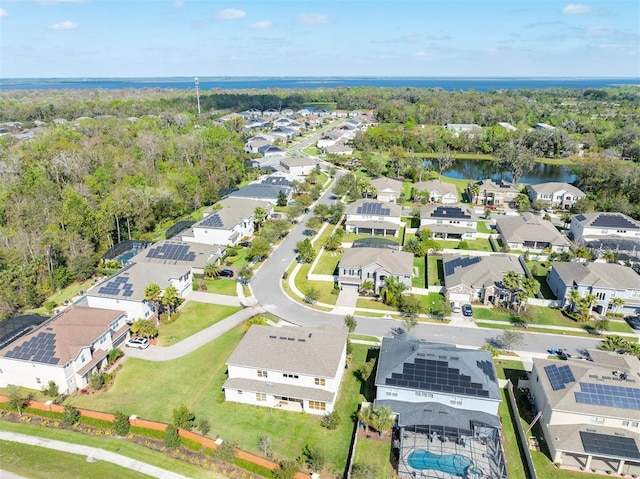 birds eye view of property with a water view and a residential view