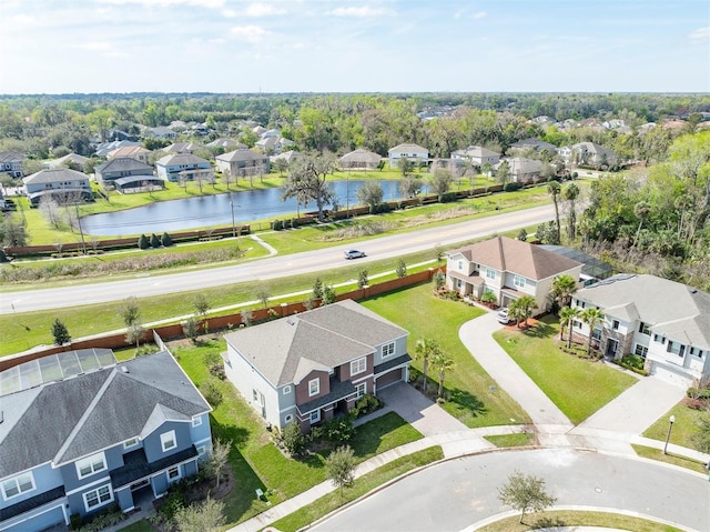 bird's eye view with a water view and a residential view