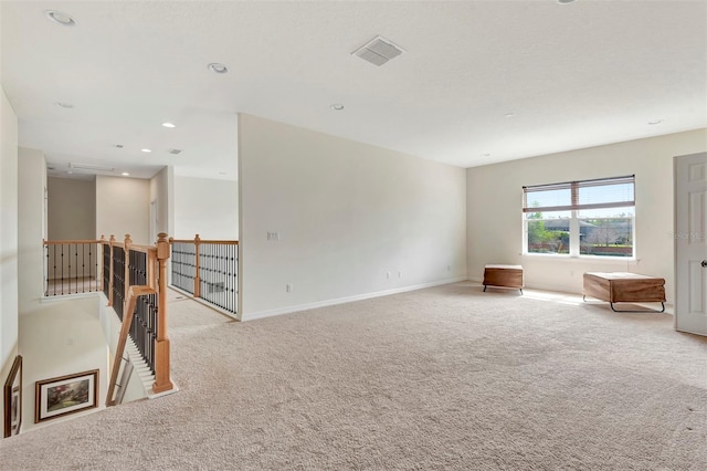 unfurnished room featuring carpet floors, recessed lighting, visible vents, and baseboards