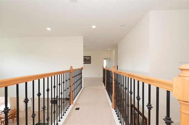 hallway featuring carpet flooring and recessed lighting