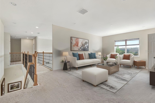 carpeted living room with visible vents and recessed lighting