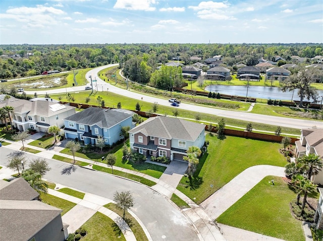 bird's eye view featuring a residential view and a water view