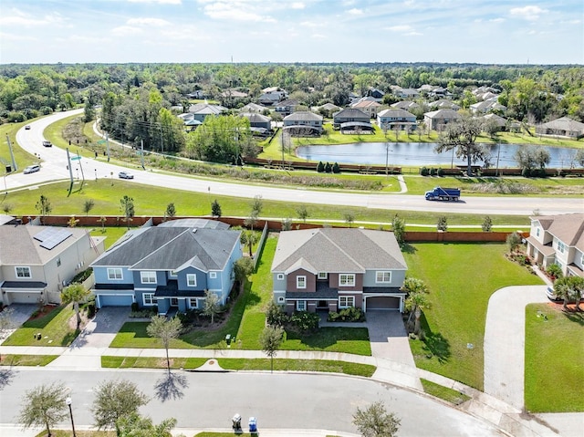 aerial view featuring a residential view and a water view