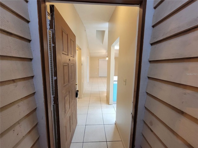 hall with light tile patterned flooring