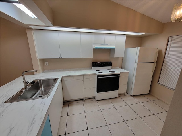 kitchen featuring electric range, white cabinets, freestanding refrigerator, under cabinet range hood, and a sink