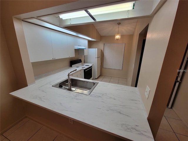 kitchen featuring electric stove, light countertops, freestanding refrigerator, a sink, and under cabinet range hood