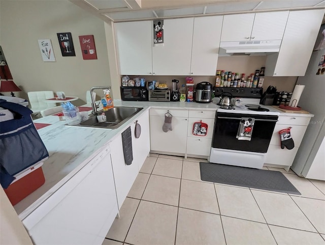 kitchen with light tile patterned floors, light countertops, a sink, white appliances, and under cabinet range hood